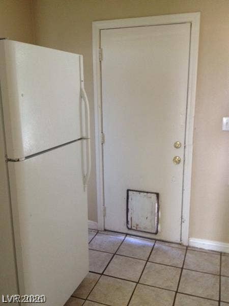 107 W Victory Road, Henderson, NV 89015 Durable tile flooring anchors this practical utility space featuring convenient exterior access.