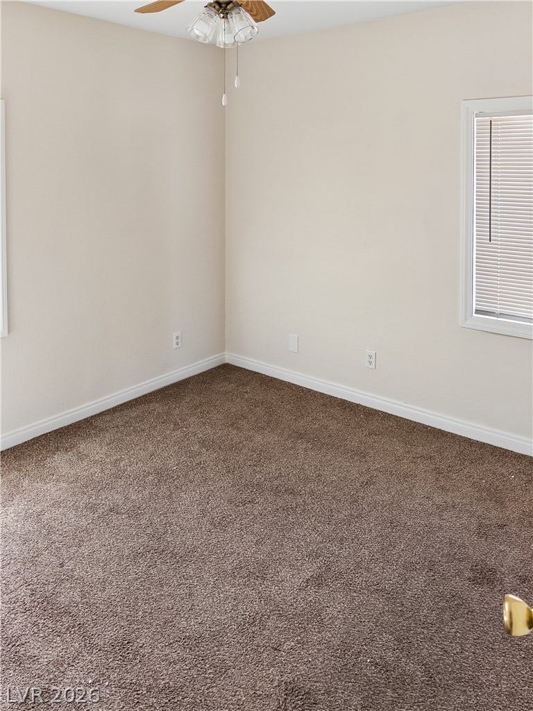107 W Victory Road, Henderson, NV 89015 Plush carpeting and dual windows define this comfortable and inviting bedroom retreat.