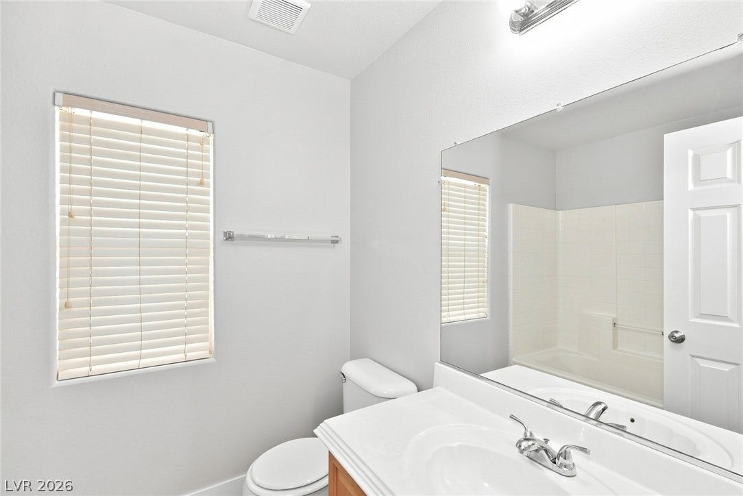 6059 Camden Cove Street, North Las Vegas, NV 89081 A window brings natural illumination into this functional bathroom space.