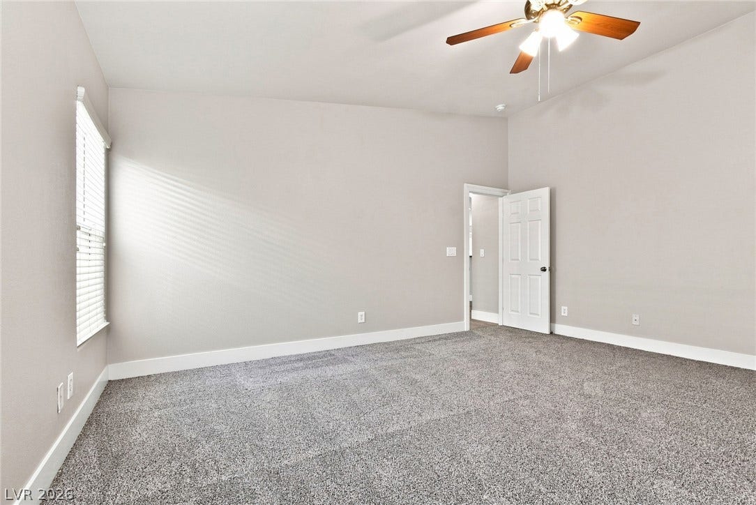 6059 Camden Cove Street, North Las Vegas, NV 89081 Plush wall-to-wall carpeting and neutral walls define this versatile secondary bedroom space.