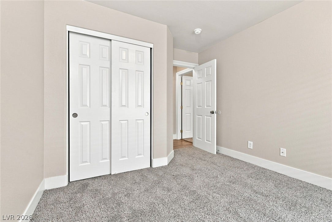 6059 Camden Cove Street, North Las Vegas, NV 89081 Plush wall-to-wall carpeting and neat trim work define this quiet bedroom space.