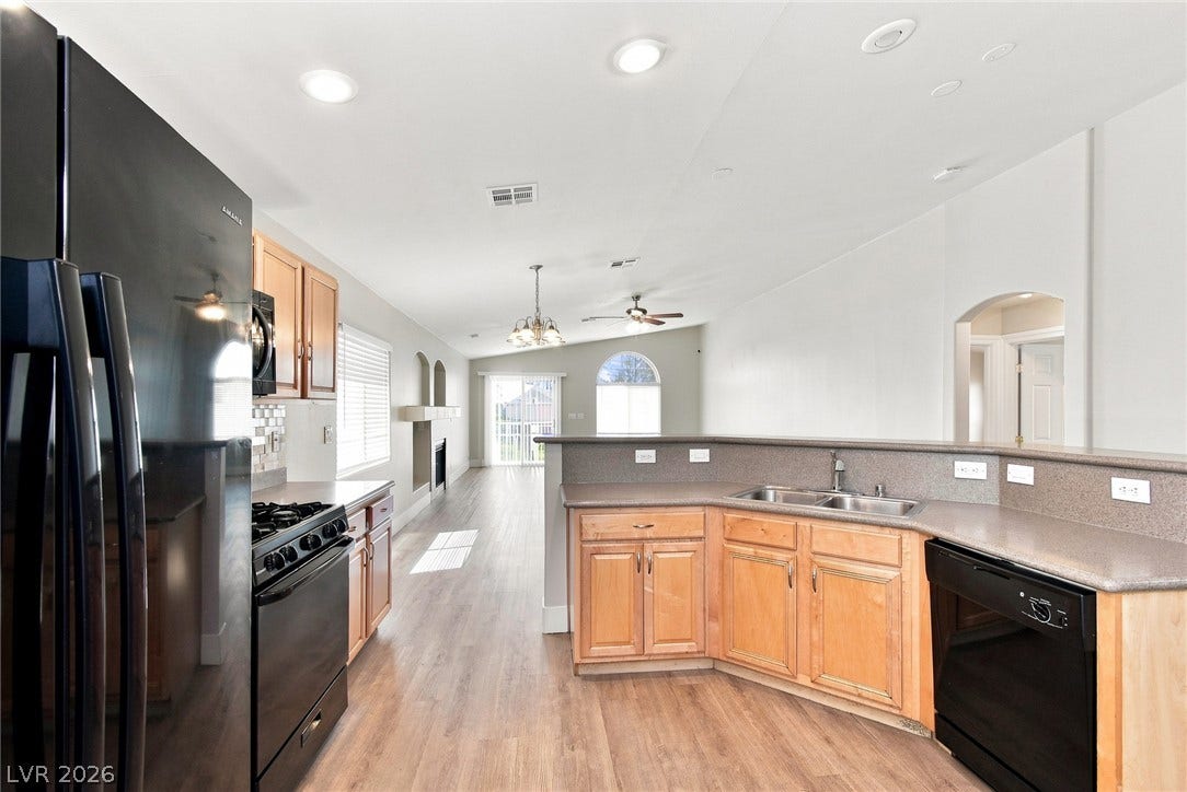 6059 Camden Cove Street, North Las Vegas, NV 89081 An open kitchen layout flows seamlessly into the light-filled main living areas.