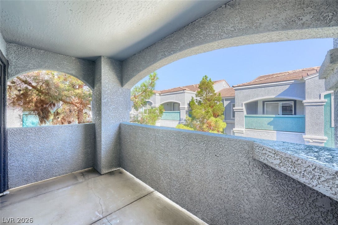 6955 N Durango Drive, #3102, Las Vegas, NV 89149 Covered balcony off the dining area, offering an inviting extension of the living space to relax and enjoy the outdoors.