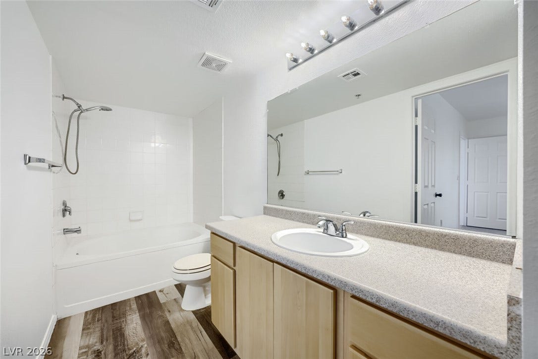 6955 N Durango Drive, #3102, Las Vegas, NV 89149 Full guest bathroom with tub/shower combination, spacious vanity and new LVP flooring, with direct access from the guest bedroom.