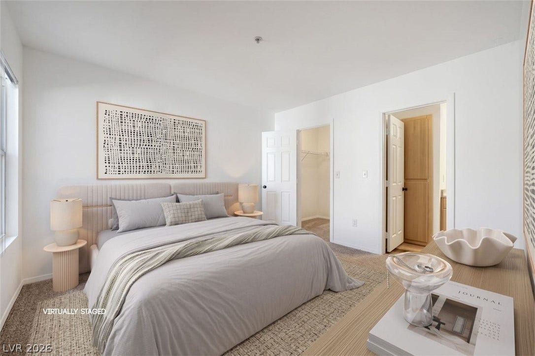6955 N Durango Drive, #3102, Las Vegas, NV 89149 Primary bedroom with new carpet and fresh paint, featuring an en suite bath and walk-in closet.