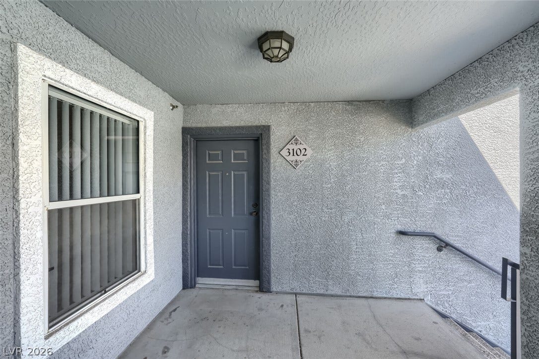 6955 N Durango Drive, #3102, Las Vegas, NV 89149 Covered third-floor entry to Unit 3102, with no unit above.