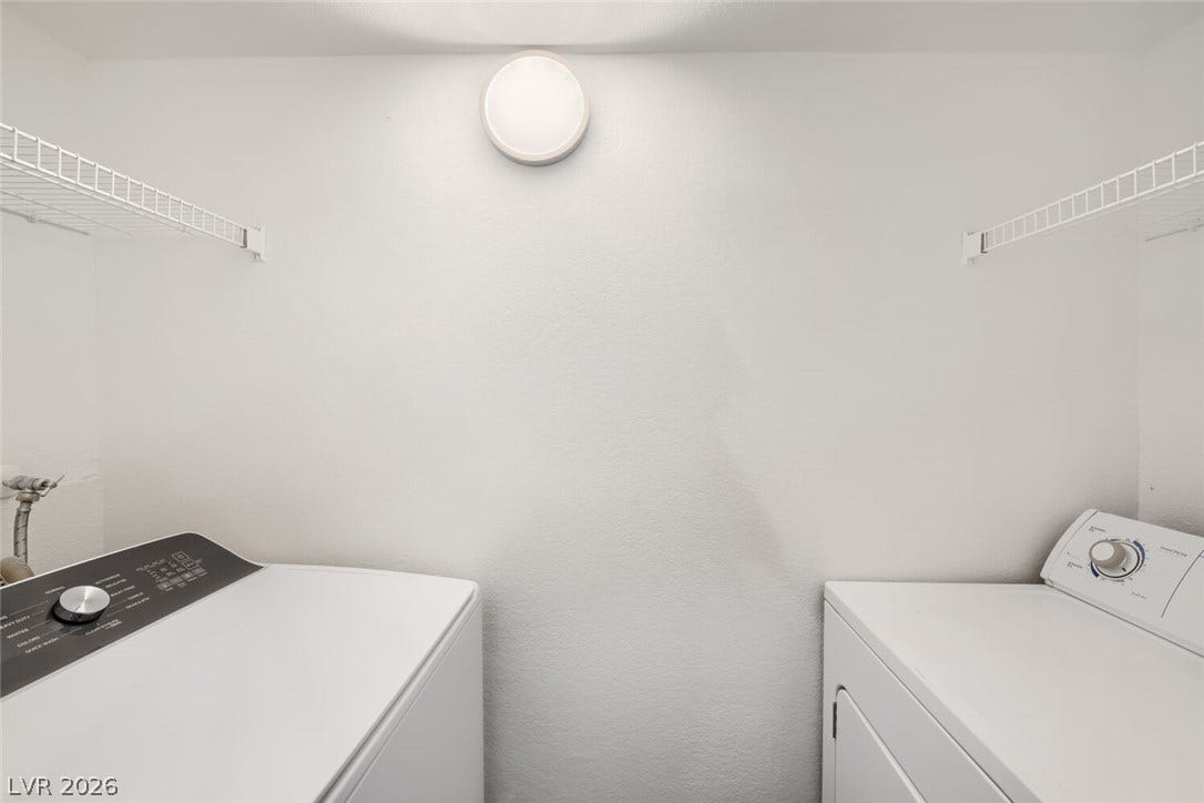 6955 N Durango Drive, #3102, Las Vegas, NV 89149 Laundry room in unit with overhead shelving, washer and dryer.