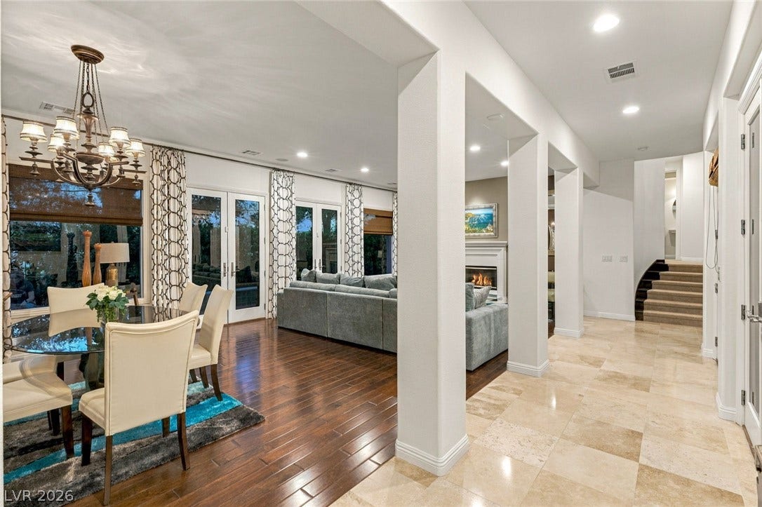 12056 Royal Dolnoch Court, Las Vegas, NV 89141 Polished stone and hardwood flooring enhance this light-filled open concept layout.