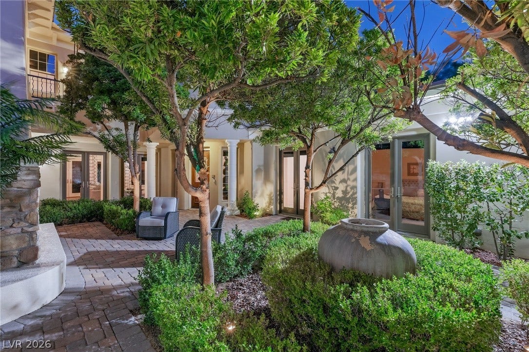 12056 Royal Dolnoch Court, Las Vegas, NV 89141 Lush landscaping and stone pavers frame this peaceful, private courtyard oasis.