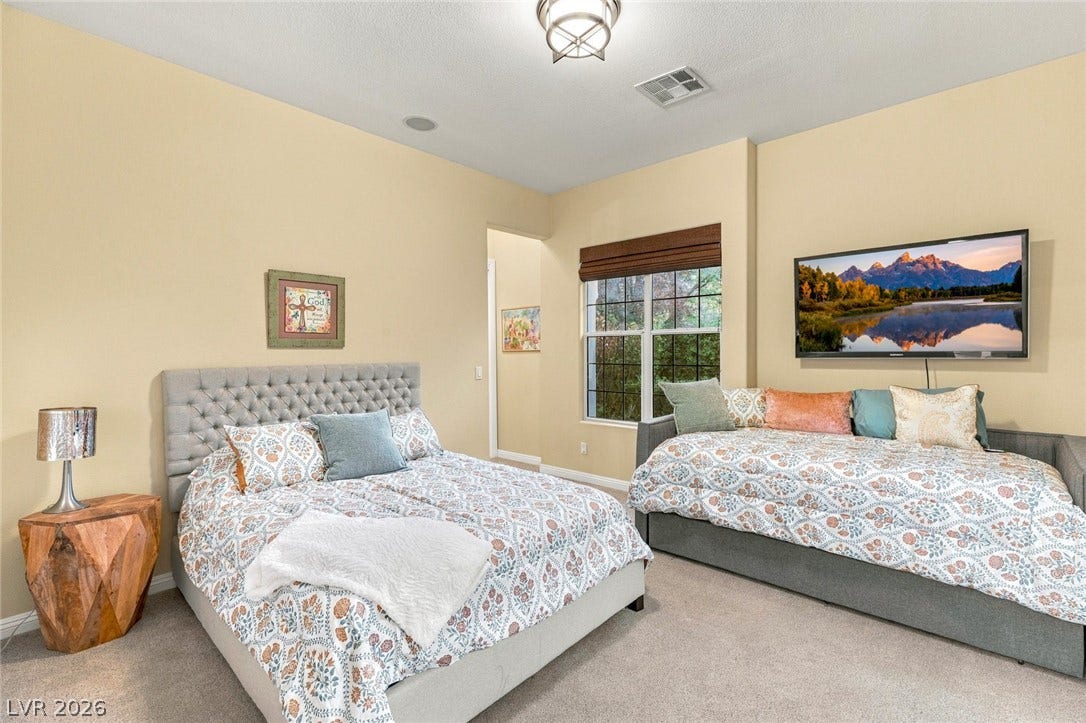 12056 Royal Dolnoch Court, Las Vegas, NV 89141 High ceilings and soft carpeting create a comfortable, inviting atmosphere in this bedroom.