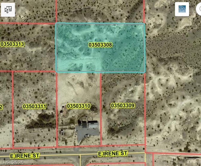 An aerial plat map outlines the parcel boundaries and natural desert terrain of this expansive lot.