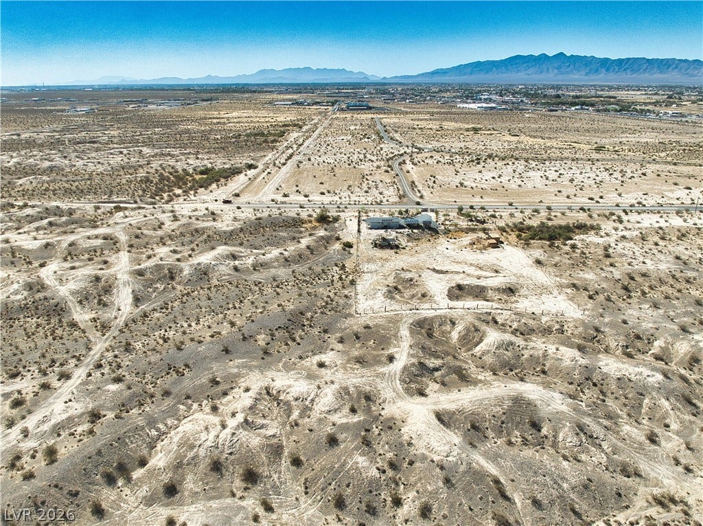 Vast desert acreage offers limitless potential framed by majestic distant mountain views.
