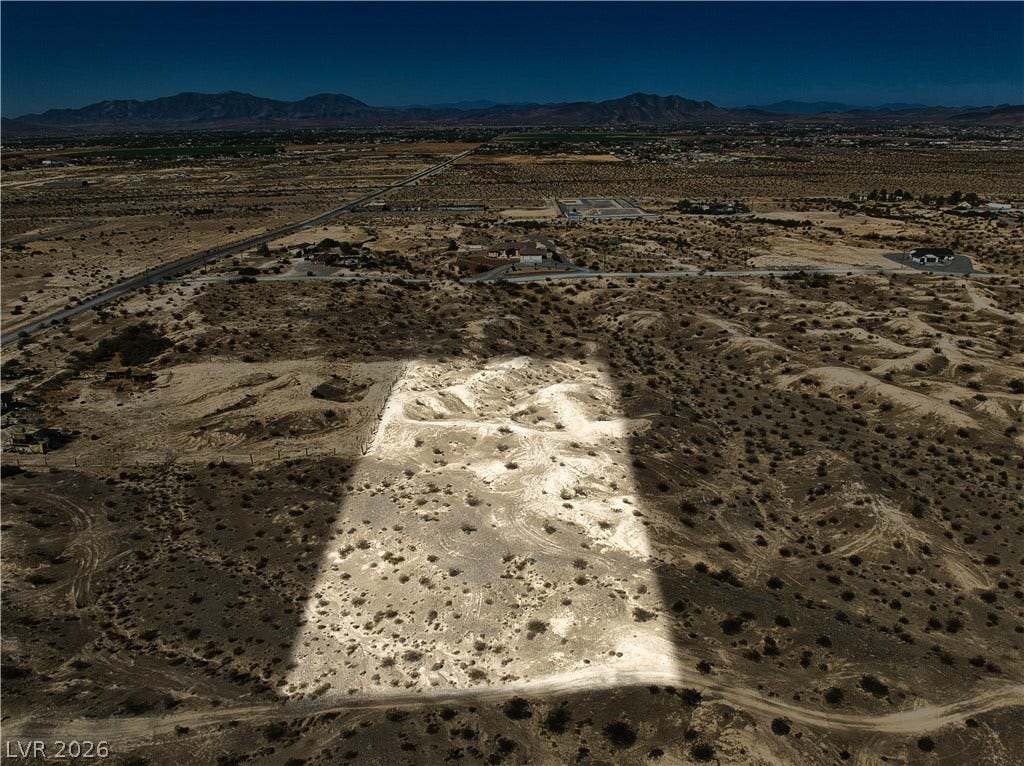 Panoramic mountain and desert views frame this expansive parcel of land.