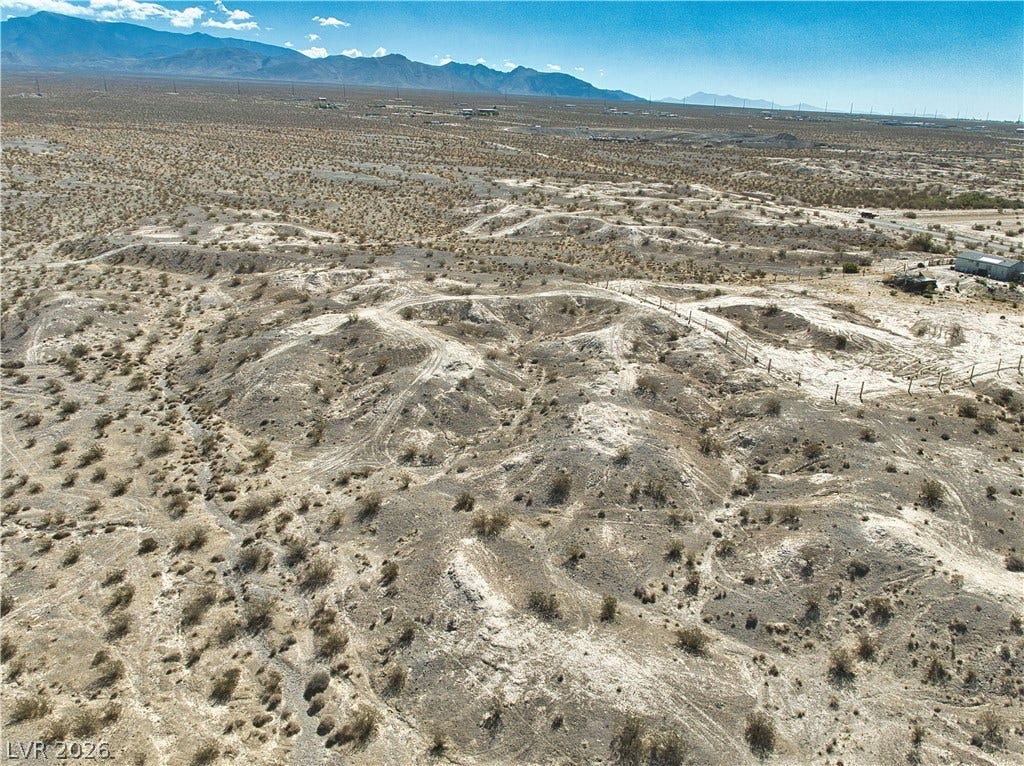 Panoramic mountain and desert vistas surround this vast, undeveloped acreage.