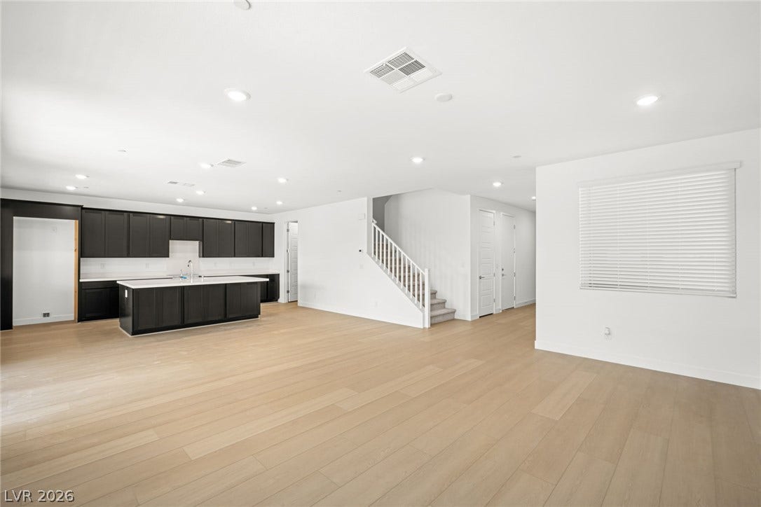 11823 Mimicking Song Lane, Las Vegas, NV 89138 Clean lines and light wood flooring define this open-concept main level layout.