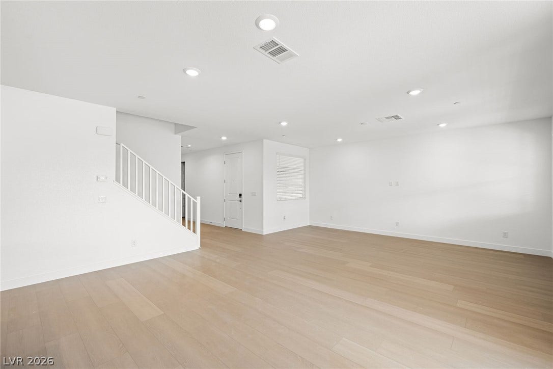 11823 Mimicking Song Lane, Las Vegas, NV 89138 Smooth wood floors and recessed lighting define this airy, open-concept living space.