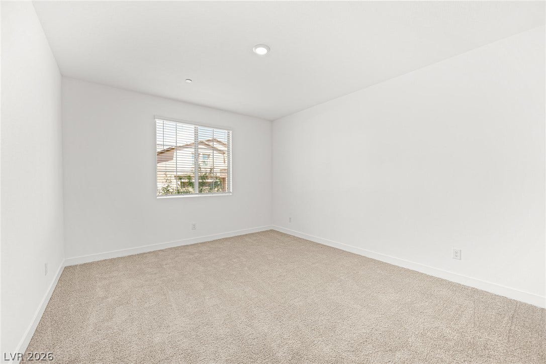 11823 Mimicking Song Lane, Las Vegas, NV 89138 Soft carpeting pairs with a bright window inside this versatile secondary bedroom space.