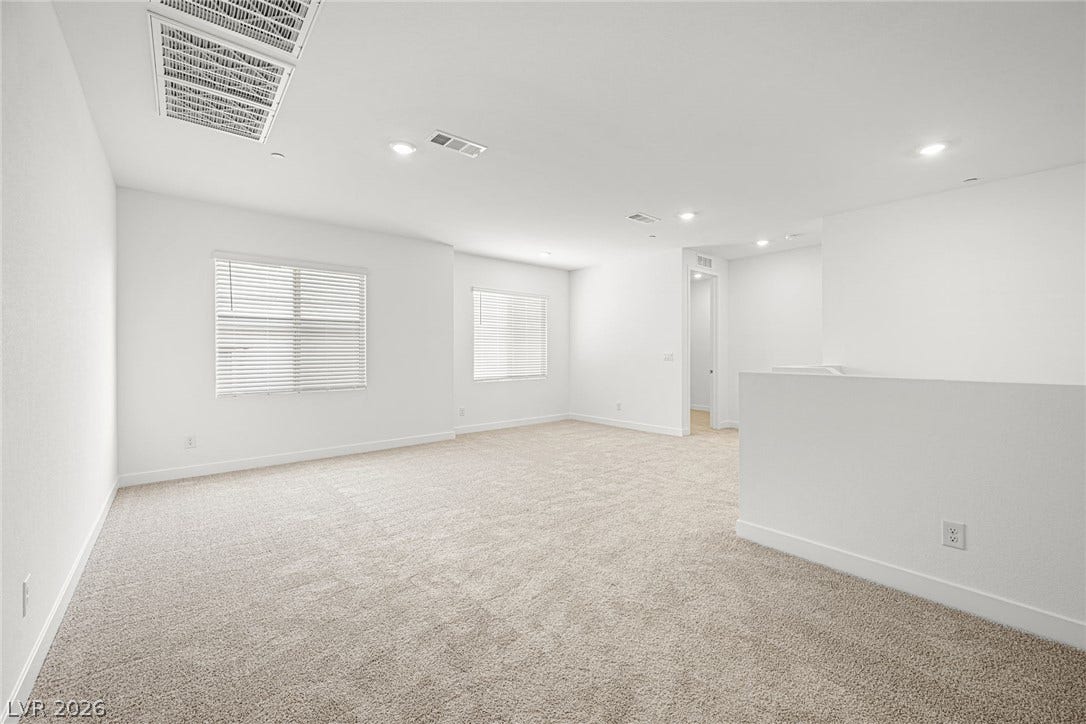 11823 Mimicking Song Lane, Las Vegas, NV 89138 Plentiful natural light fills a versatile upper-level loft with soft carpeting.