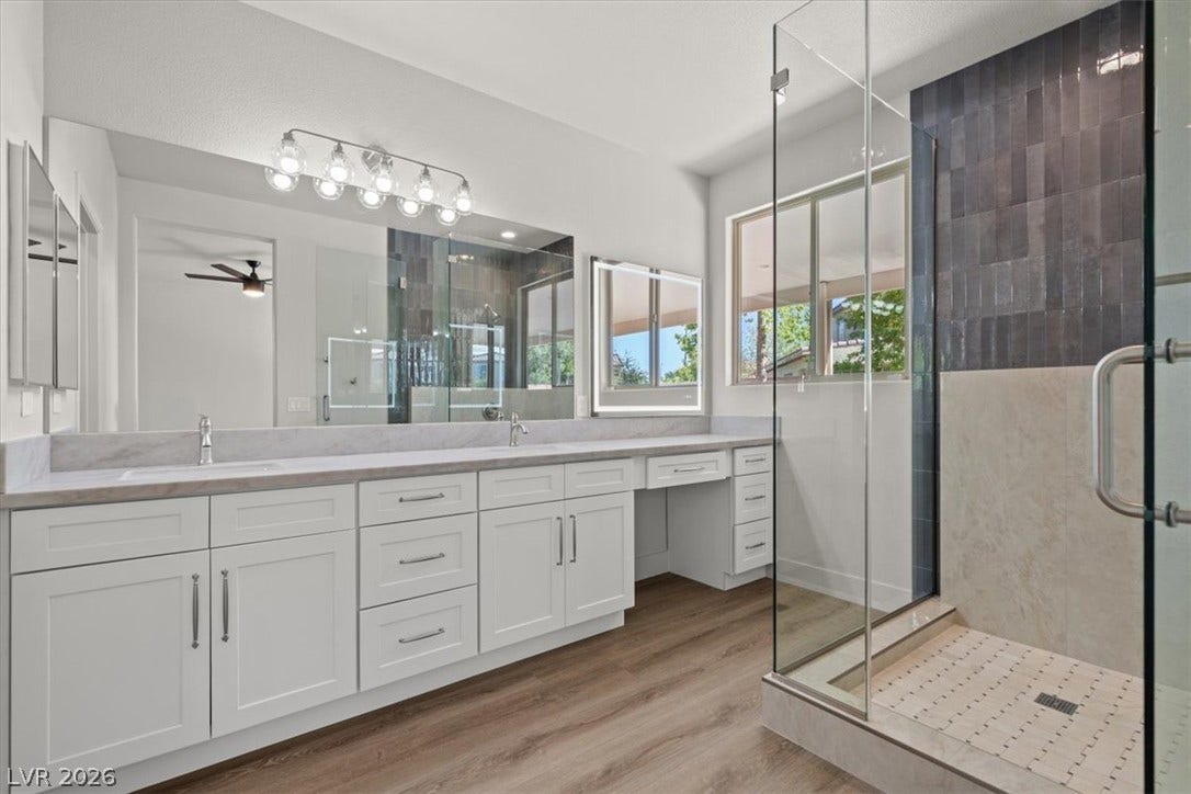 1874 Nature Park Drive, North Las Vegas, NV 89084 Clean lines and a spacious glass shower define this contemporary primary bath oasis.