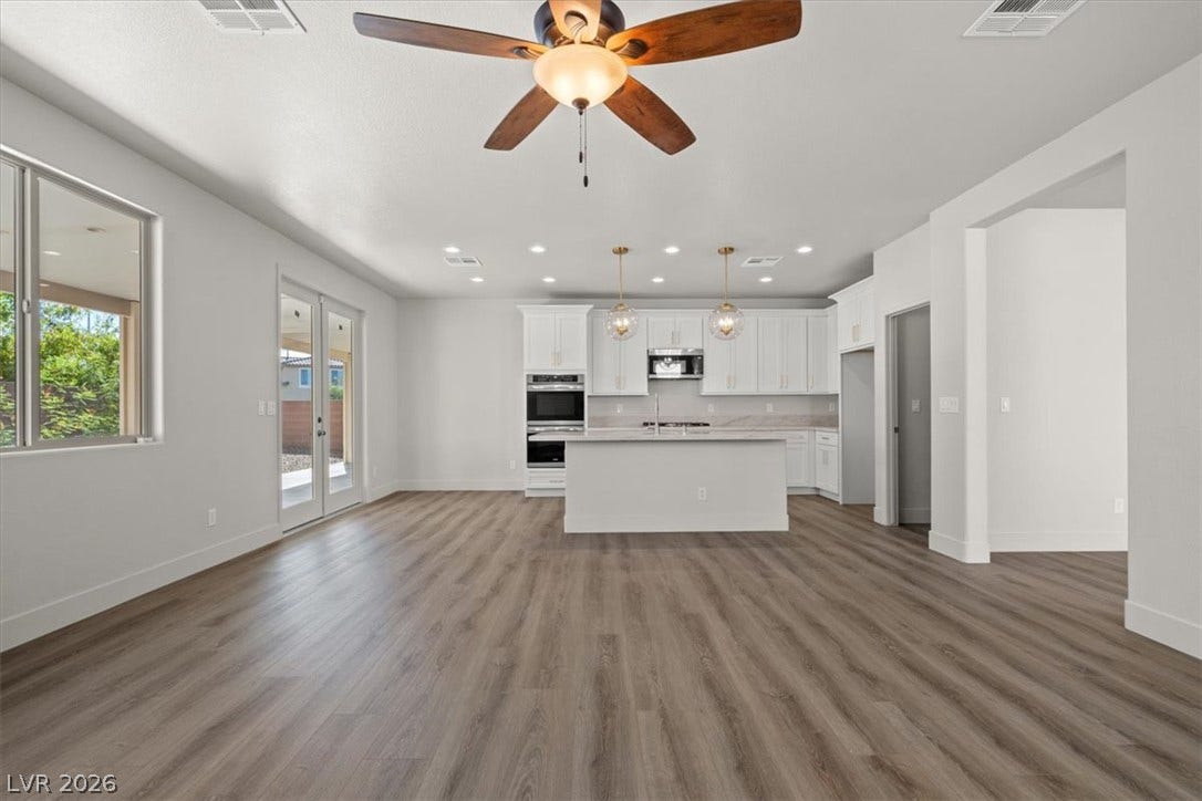 1874 Nature Park Drive, North Las Vegas, NV 89084 An open floor plan integrates the spacious living area and kitchen with clean modern finishes.