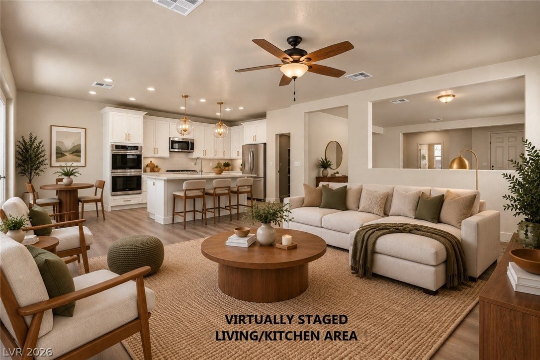 1874 Nature Park Drive, North Las Vegas, NV 89084 An open floorplan seamlessly connects the inviting living room to the modern kitchen.