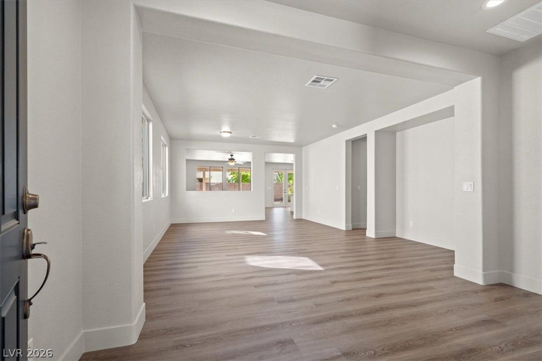 1874 Nature Park Drive, North Las Vegas, NV 89084 An open floorplan maximizes light across durable wood-look flooring and clean architectural lines.