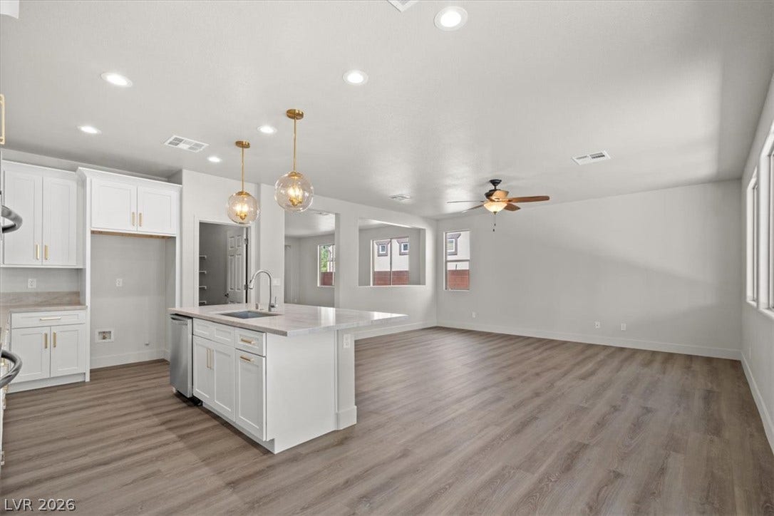 1874 Nature Park Drive, North Las Vegas, NV 89084 Clean lines and warm wood floors define this versatile open-concept living area.