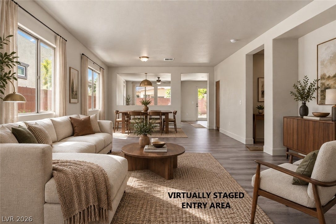 1874 Nature Park Drive, North Las Vegas, NV 89084 Smooth wood-look flooring and ample windows enhance this welcoming open concept living space.