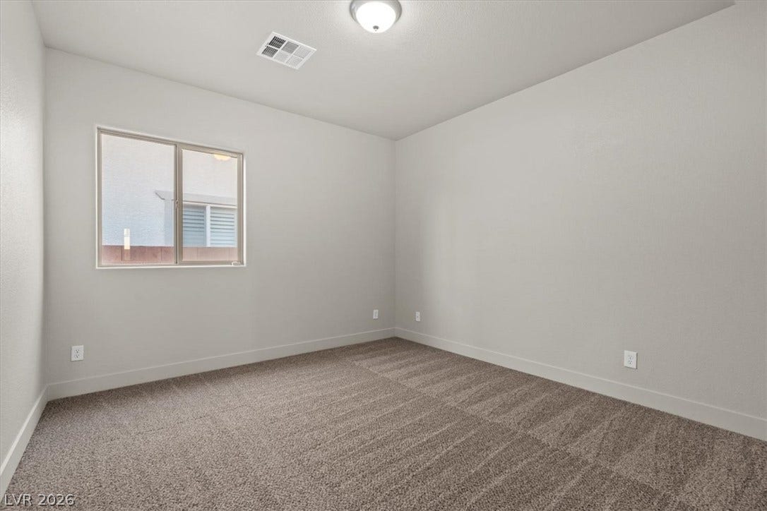 1874 Nature Park Drive, North Las Vegas, NV 89084 Plush carpeting and an abundance of natural light define this versatile secondary bedroom.