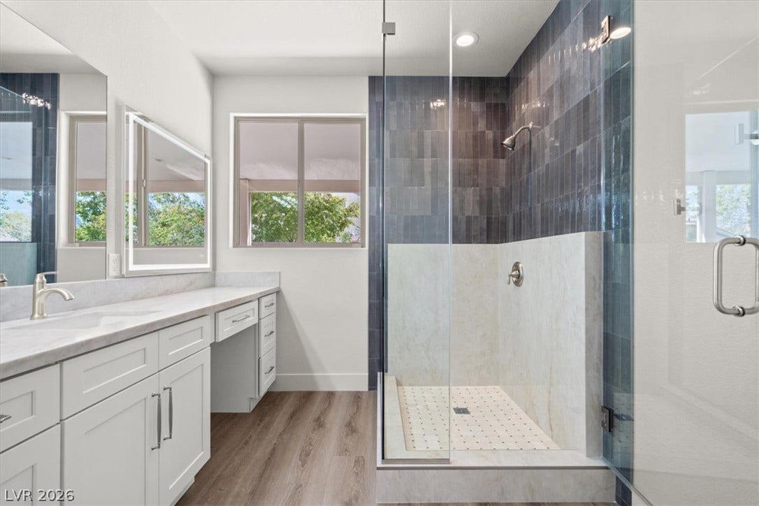 1874 Nature Park Drive, North Las Vegas, NV 89084 Clean lines and a walk-in shower define this contemporary primary bath.