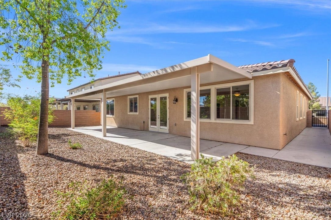 1874 Nature Park Drive, North Las Vegas, NV 89084 A spacious covered concrete patio overlooks the low-maintenance gravel backyard landscape.