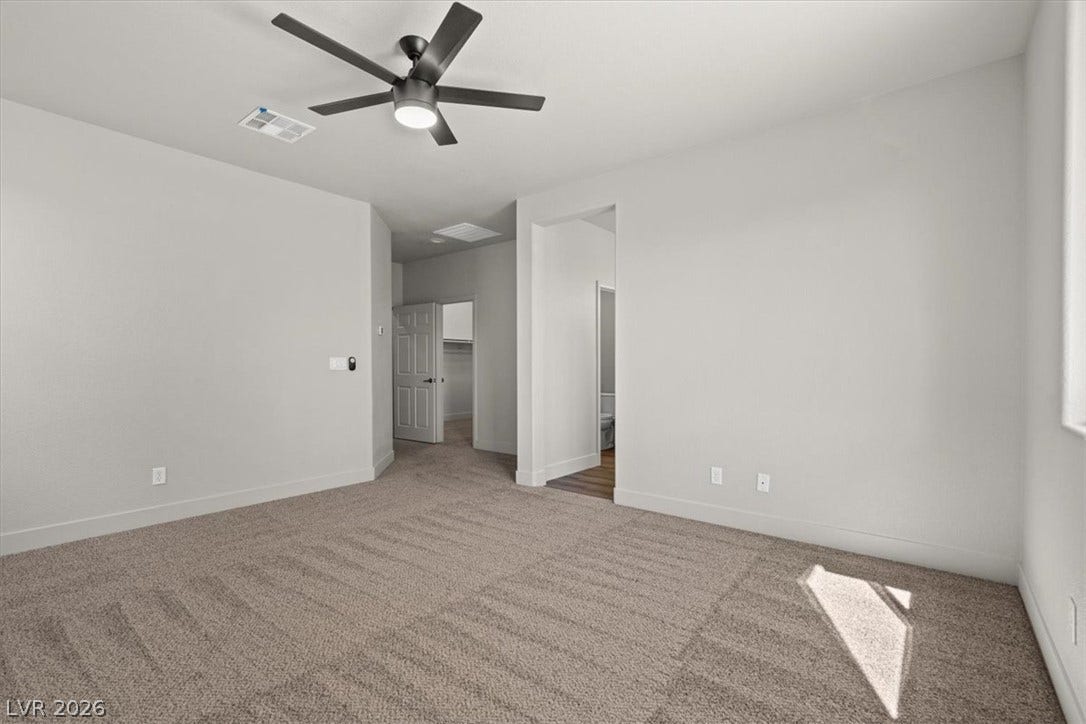 1874 Nature Park Drive, North Las Vegas, NV 89084 Soft carpeting underfoot defines this comfortable room layout.
