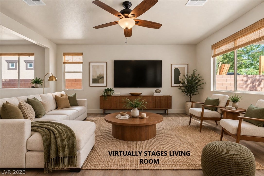 1874 Nature Park Drive, North Las Vegas, NV 89084 An open living space features wood-style flooring and large windows framing outdoor views.