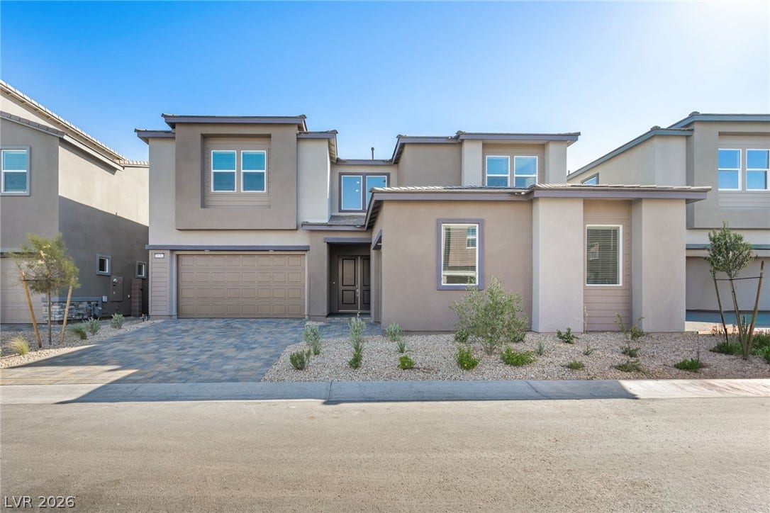 A contemporary faade with an inviting entrance, showcasing a sophisticated exterior design.