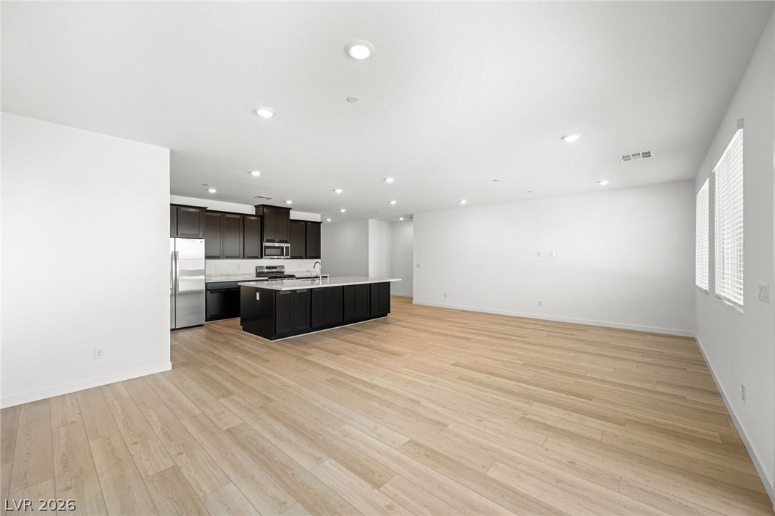 1663 Capri Falls Court, Henderson, NV 89011 An open layout integrates the main living space with a modern, well-equipped kitchen.