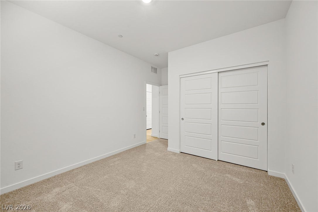 1663 Capri Falls Court, Henderson, NV 89011 Crisp walls and plush carpeting create a clean canvas in this versatile room.