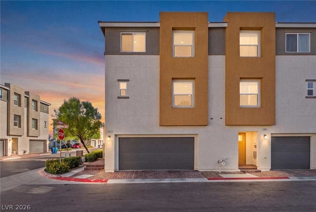 10059 Dazzling Sunrays Avenue, Las Vegas, NV 89129 Modern multi-level exterior architecture features clean lines, smooth stucco finishes, and integrated garage parking.