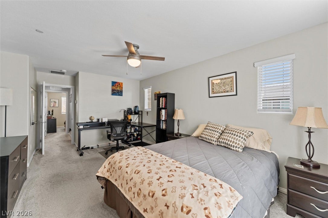 10059 Dazzling Sunrays Avenue, Las Vegas, NV 89129 Plush carpeting and abundant natural light create a welcoming and comfortable retreat.