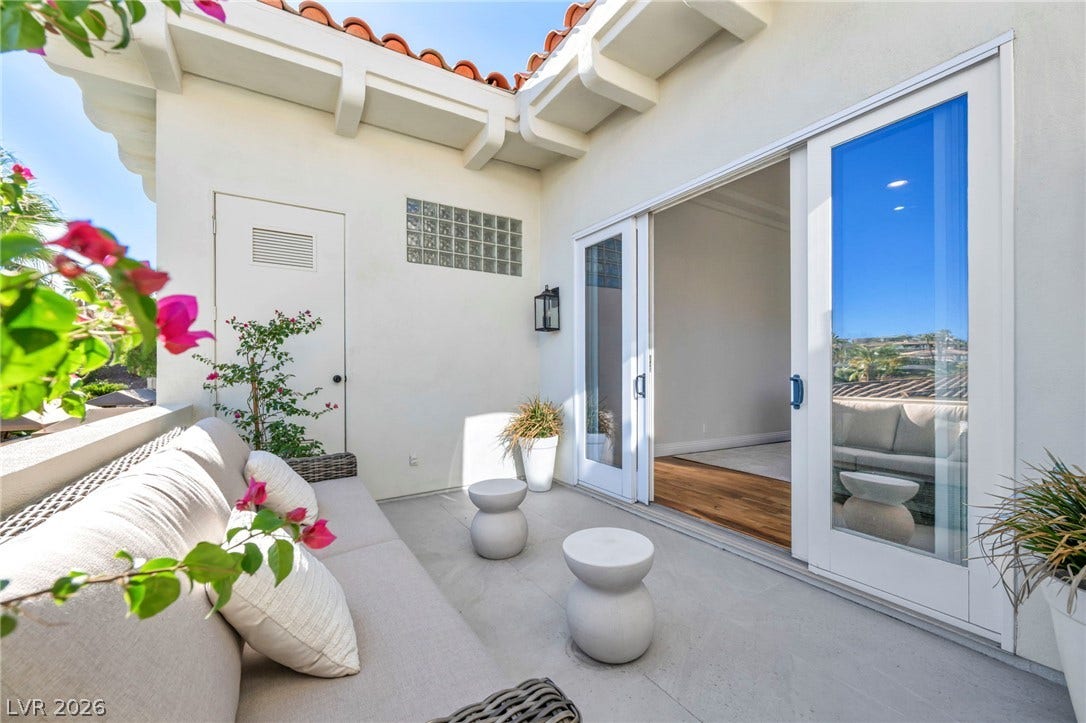 8805 Spanish Mountain Drive, Las Vegas, NV 89148 Sliding glass doors connect this sun-drenched private balcony to the inviting interior living spaces.