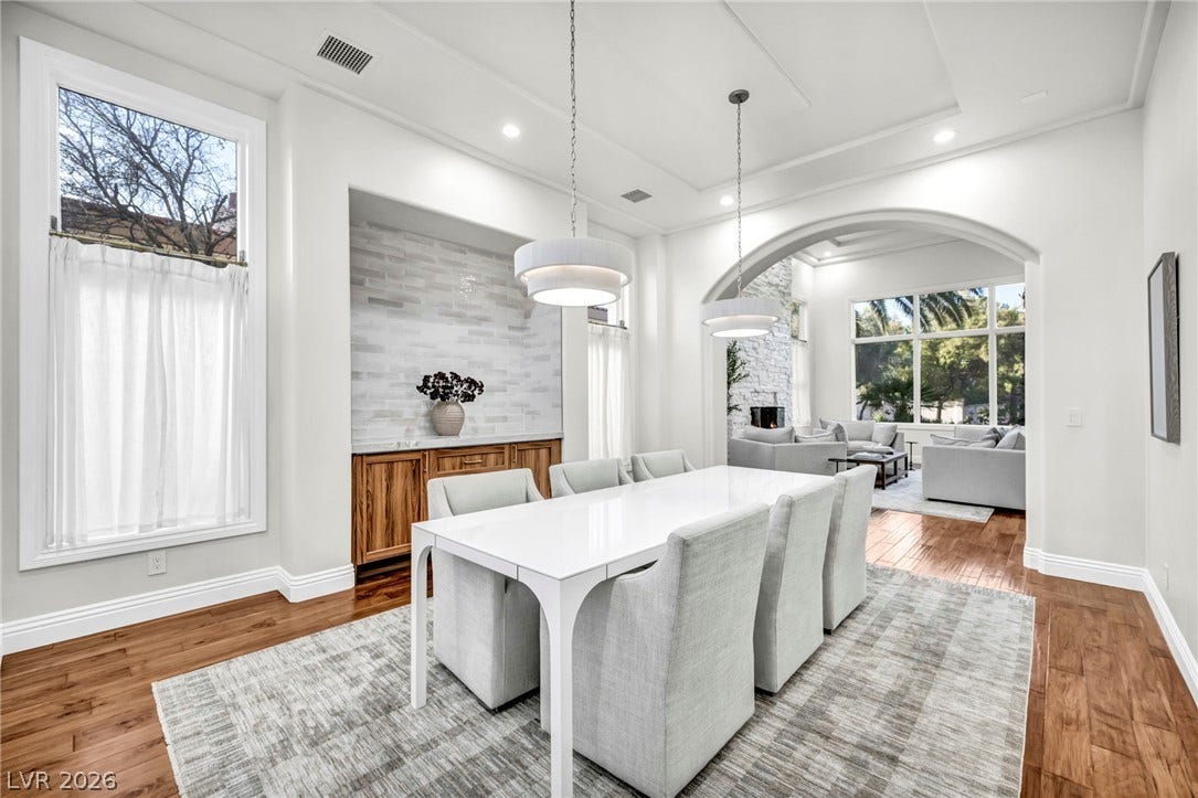 8805 Spanish Mountain Drive, Las Vegas, NV 89148 Gleaming hardwood floors and a customized tray ceiling elevate this elegant dining space.