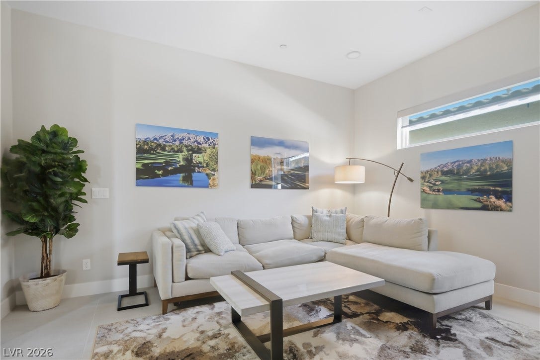 High ceilings and clean architectural lines define this welcoming living space.