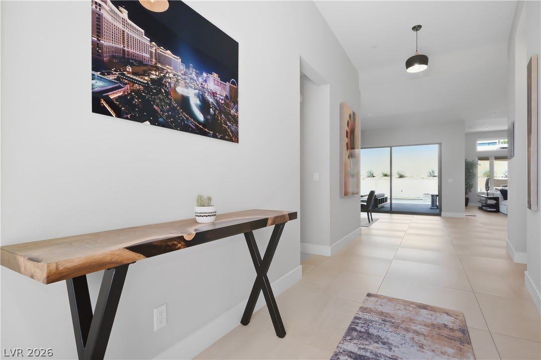An inviting entryway transitions smoothly into a luminous, modern open-concept floor plan.