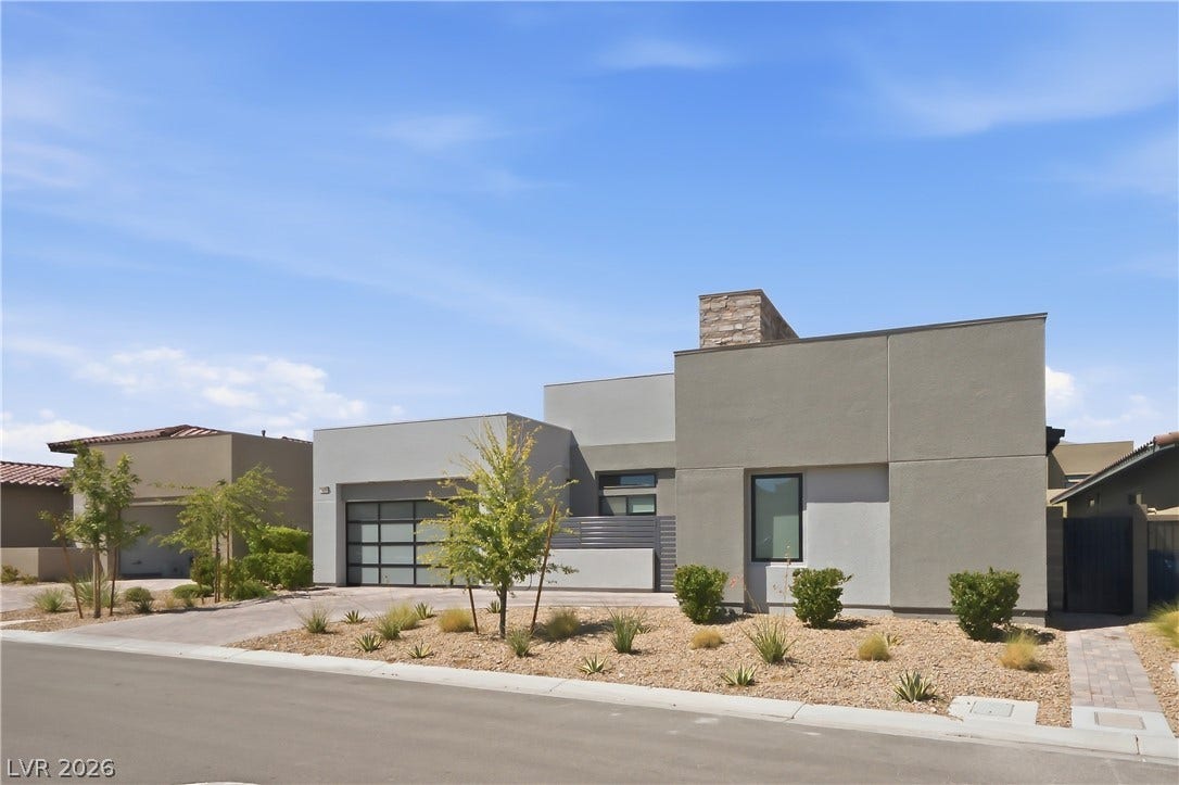 Clean architectural lines define this modern single-story residence with desert landscaping.