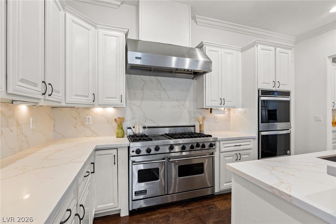 8088 Dark Hollow Place, Las Vegas, NV 89117 Culinary dreams come to life in this kitchen, featuring stainless steel appliances and abundant counter space.