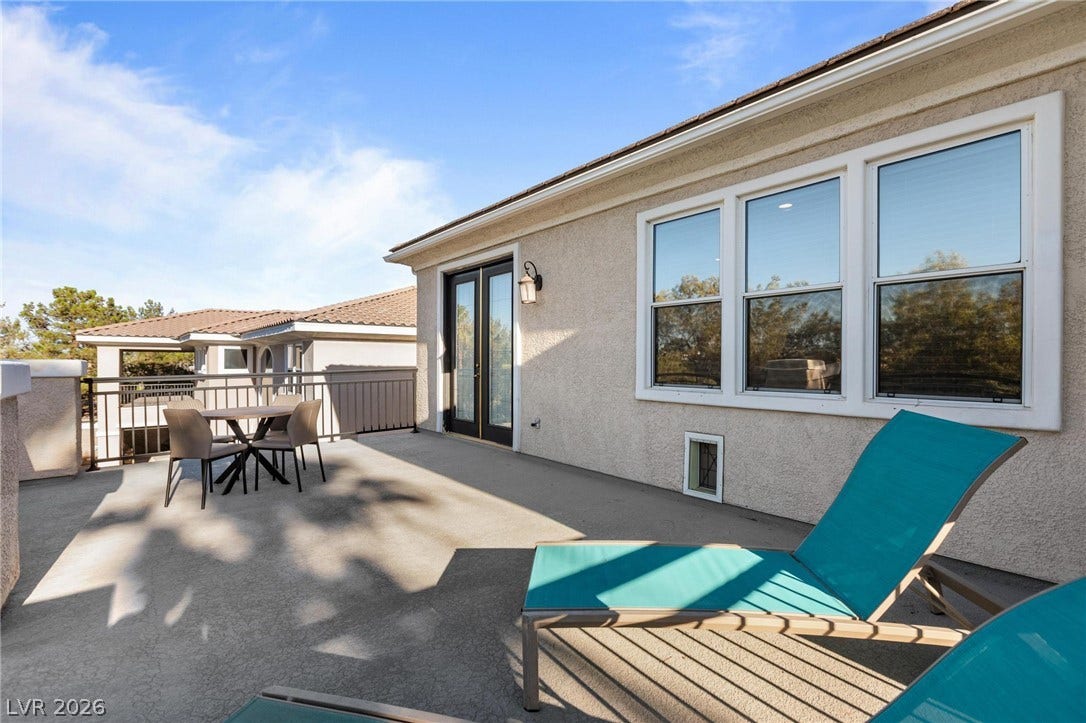 8088 Dark Hollow Place, Las Vegas, NV 89117 An inviting private patio awaits, perfect for serene outdoor relaxation and enjoying elevated neighborhood views.