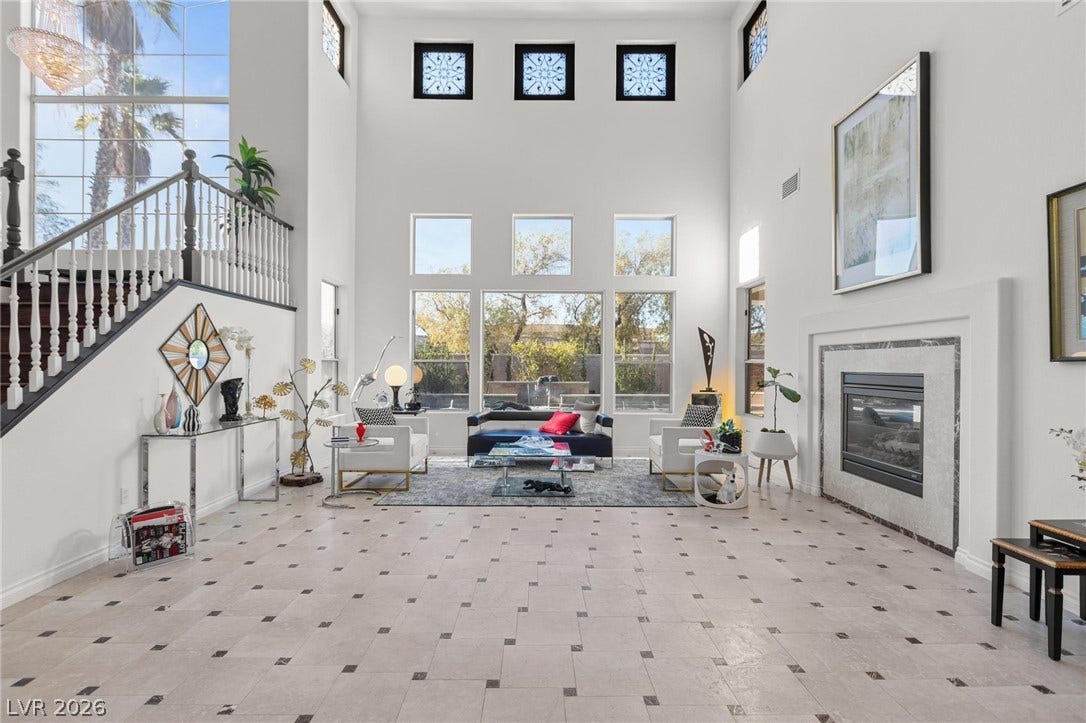 8088 Dark Hollow Place, Las Vegas, NV 89117 Grand foyer with soaring ceilings and a sweeping staircase greets visitors with an immediate sense of luxurious spaciousness.