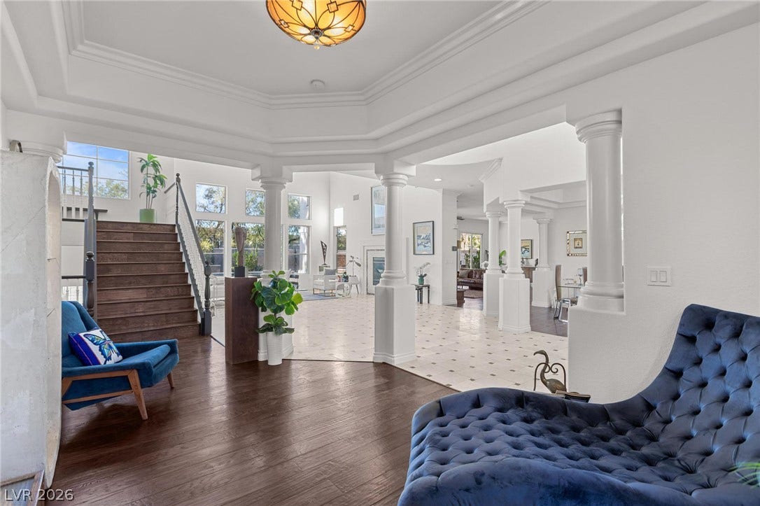 8088 Dark Hollow Place, Las Vegas, NV 89117 Grand entryway with architectural columns and a graceful staircase creates an immediate impression of luxury.