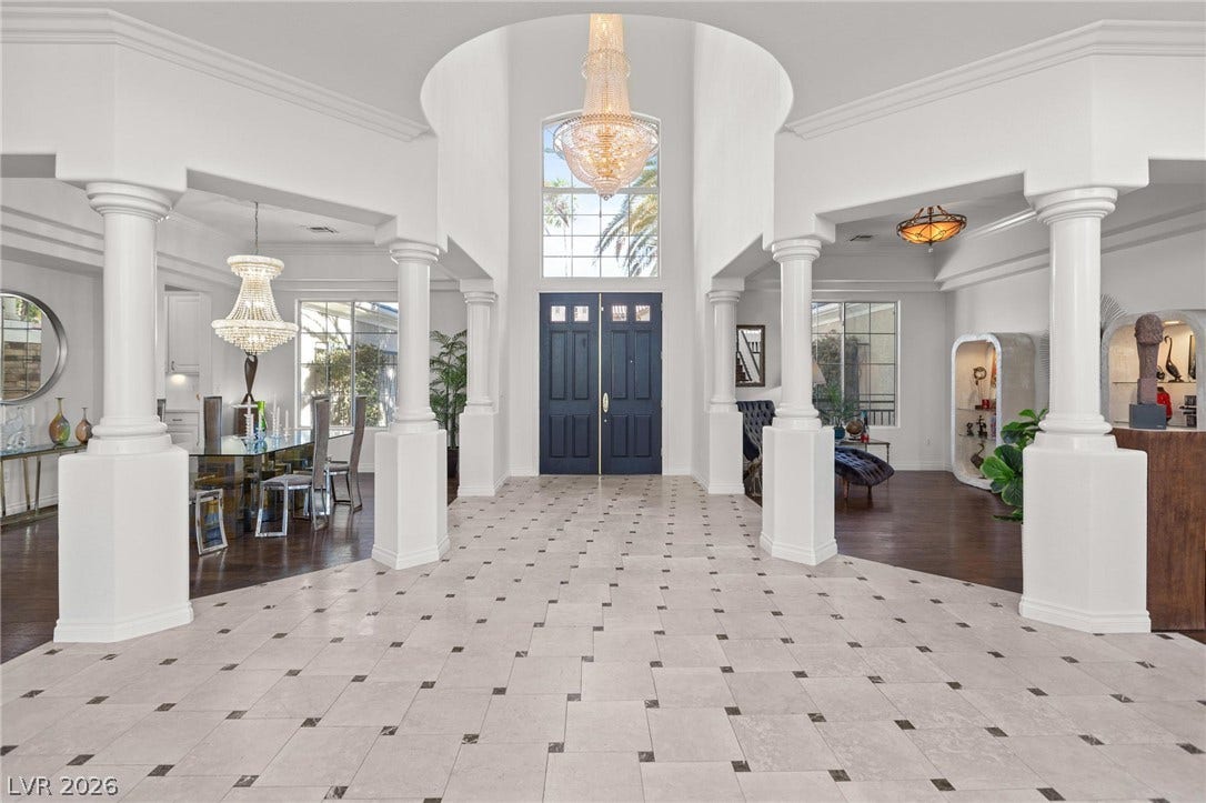 8088 Dark Hollow Place, Las Vegas, NV 89117 Grand foyer with soaring ceilings and decorative columns provides an elegant welcome.