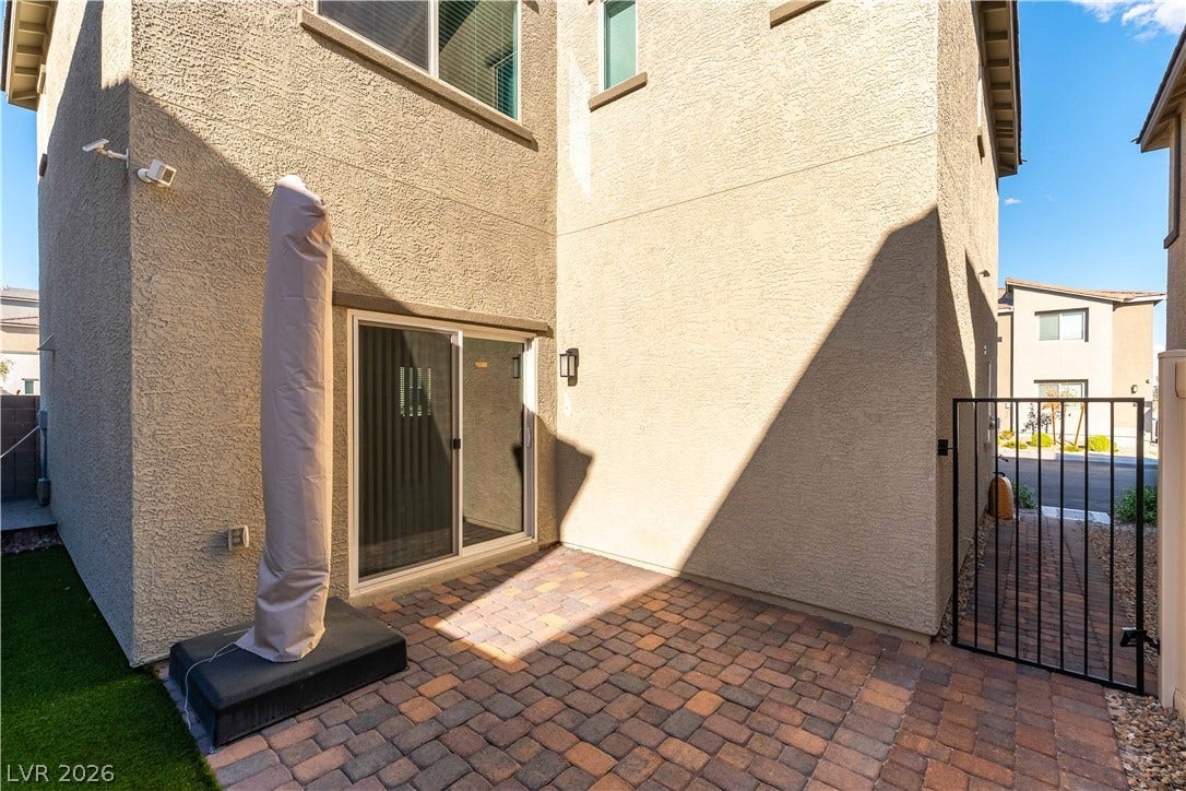 6911 Orange Horizon Street, North Las Vegas, NV 89086 A private paved courtyard provides a quiet outdoor retreat just outside the sliding glass door.