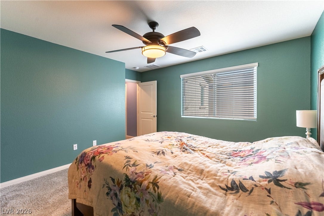6911 Orange Horizon Street, North Las Vegas, NV 89086 Plush carpeting and natural light define this restful space.